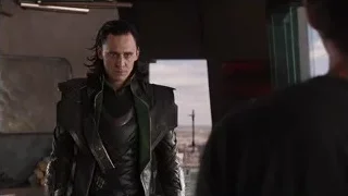 Loki standing before city skyline — The Avengers