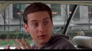 young man in car on city street — Spider Man
