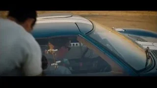 man in blue sports car — Ford v Ferrari