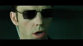 man with sunglasses serious expression — The Matrix