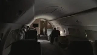 Dimly lit airplane interior at night — Succession