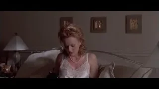 woman sitting on couch in living room — American Psycho