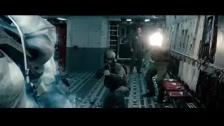 man in futuristic suit holding gun — Superman: Man of Steel