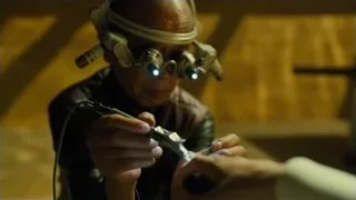 man in futuristic helmet working on device — Blade Runner 2049