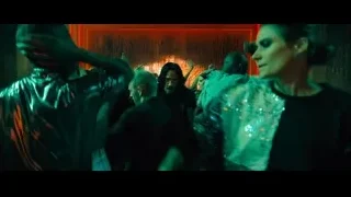 people dancing in dimly lit room rock formation — John Wick: Chapter 4