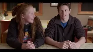 young couple smiling at kitchen counter — The Social Dilemma