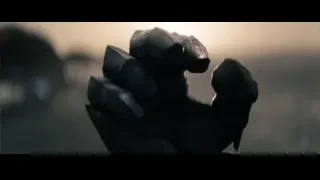 robot hand holding metal objects — Superman: Man of Steel