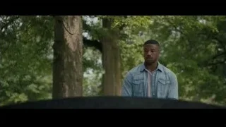 young man deep in thought in park — Creed 2