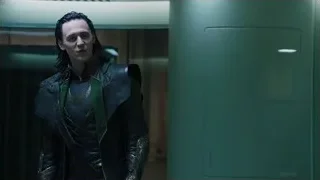 man in black and green suit in hallway — The Avengers