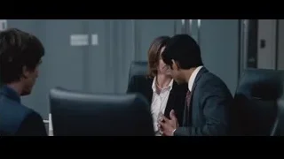 man and woman conversing in office — The Big Short