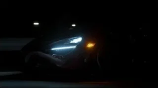 Car driving on road at night — Sports Cars