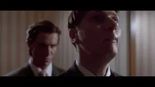 Two men in bathroom with mirror — American Psycho