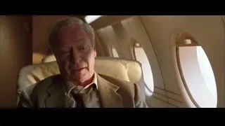Elderly man sitting in airplane — Batman