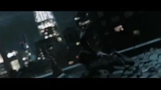 person on rooftop looking at city at night — Doctor Strange 2