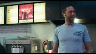 man with Original Beef shirt talking in kitchen — The Bear