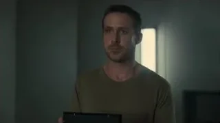 Man standing in dimly lit room — Blade Runner 2049