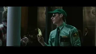 person wearing green uniform with badge — Now You See Me 2