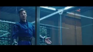 man in blue suit in futuristic glass room — Doctor Strange 2
