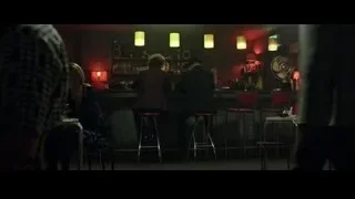 people sitting at dimly lit bar — Now You See Me 2