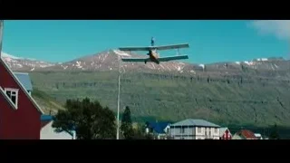 Small plane flying over town — The Secret Life of Walter Mitty