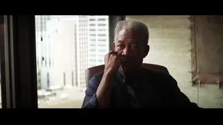 elderly man in chair with city view — Batman: The Dark Knight