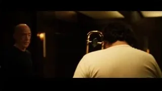 bald man in dimly lit room — Whiplash