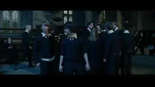 Young people in formal attire in dim room — Harry Potter and the Goblet of Fire