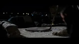 Person working at night construction site — Batman: The Dark Knight Rises
