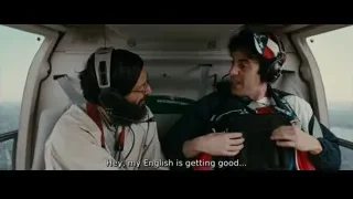 two men in helicopter cockpit looking at tablet — The Dictator