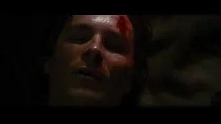 Man's bloody face in dark setting — Batman: The Dark Knight Rises