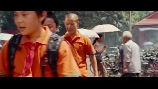 People walking on street with bicycles — The Karate Kid