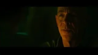 man with serious expression in green lit room — Whiplash
