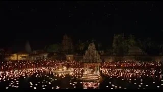 people gathered around temple at night — Life of Pi