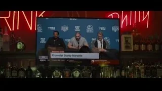 two men holding microphones at bar — Creed 2