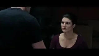 woman facing man in dimly lit room — Deadpool