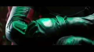 person's hand holding green weapon — Deadpool 2