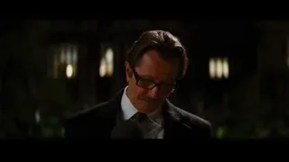 Man with mustache speaking at microphone — Batman: The Dark Knight Rises