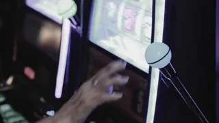 microphone in front of slot machine — Screened Out