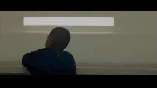 Young boy in room with white wall — Creed