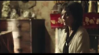 woman sitting in room with wooden dresser — Peaky Blinders