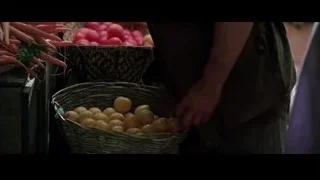 hand holding radishes at an outdoor market — Batman