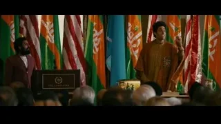 Two men giving speech before flags — The Dictator