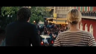 man and woman facing crowd on street — Now You See Me