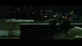 man on rooftop at night looking at city — The Matrix