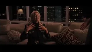 Woman sitting on couch with city skyline view — The Wolf Of Wall Street