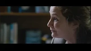 Man in suit and woman in room — The Big Short