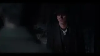 man in black coat in dimly lit room — Peaky Blinders