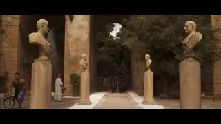 people walking through stone archway — Gladiator
