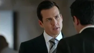Two men in suits talking in office — Suits