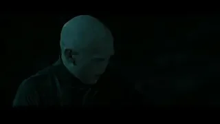 Bald man in dark outfit with serious expression — Harry Potter and the Deathly Hallows 2